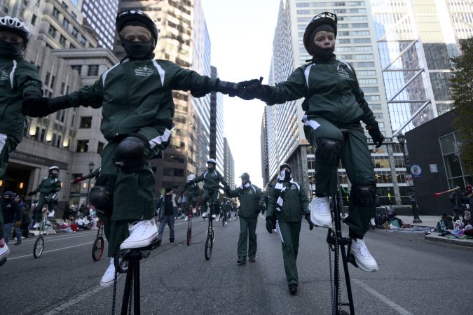 parade giraffe riders